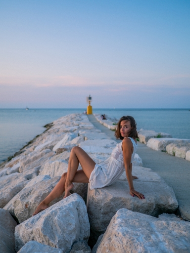 Conceptual-twilight-portrait-photo-session-of-a-beautiful-girl-in-the-sea-of-Rimini